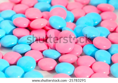 red and blue pills on white background. Macro
