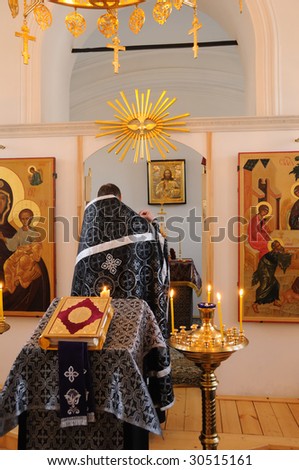 The orthodox priest serves in church of a female monastery