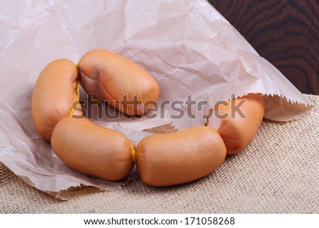Sausages in paper packet