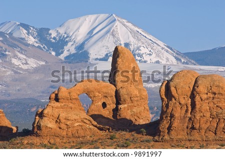 Turret Arch and snow covered mountains, Arches National Park, Utah, USA