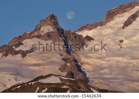 Full moon setting over Mt. Rainier, Mt. Rainier National Park, Washington, USA