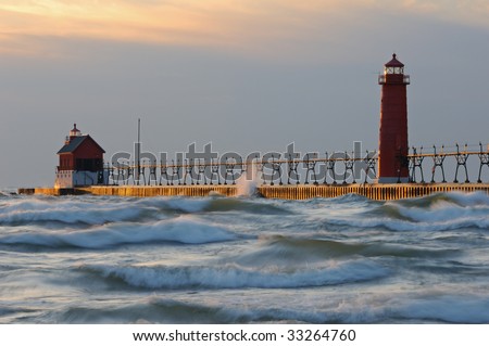 Grand Haven, Michigan lighthouses with splashing waves, pier, and catwalk, Lake Michigan