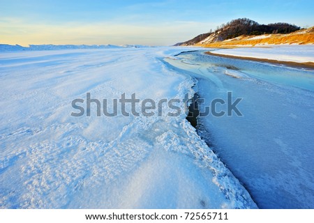 Winter shoreline of Lake Michigan at twilight, Saugatuck Dunes State Park, Michigan, USA