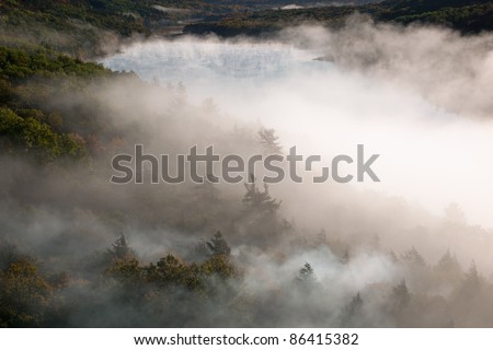 Foggy autumn landscape at sunrise, Lake of the Clouds, Porcupine Mountains Wilderness State Park, Michigan\'s Upper Peninsula, USA