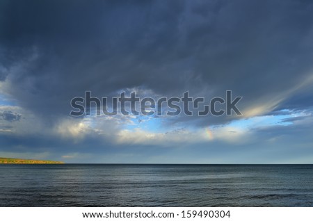 Lake Superior, rainbow, and clouds at Porcupine Mountains Wilderness State Park, Michigan\'s Upper Peninsula, USA