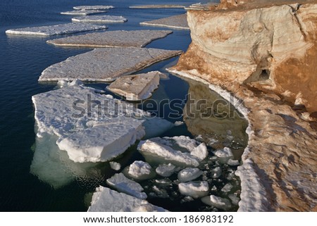 Winter landscape of frozen shoreline and icebergs, Lake Michigan, Frankfort, Michigan, USA
