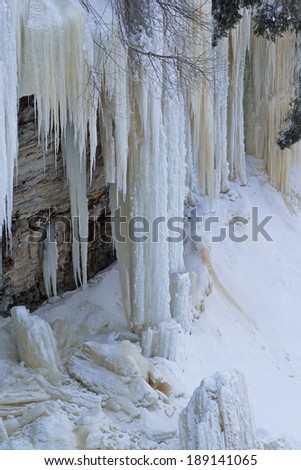 Landscape of icicles hanging from cliff at Tahquamenon Falls State Park, Michigan's Upper Peninsula, USA