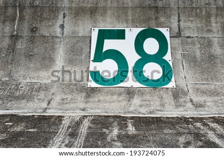 Number 58 on a concrete wall, Concept for number, Background with number