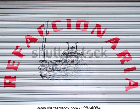 AGUASCALIENTES, MEXICO - SEPTEMBER 16, 2013: Shutter with Samurai warrior image of automotive parts shop in Aguascalientes city, the capital of Aguascalientes state. About 1 million population.