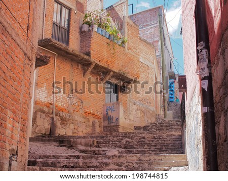 GUANAJUATO, MEXICO - OCTOBER 26, 2013: World Heritage Site (1988). Historic mine city has a lot of 16th century buildings and narrow stone paved streets. About 170,000 population.