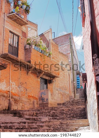 GUANAJUATO, MEXICO - OCTOBER 26, 2013: World Heritage Site (1988). Historic mine city has a lot of 16th century buildings and narrow stone paved streets. About 170,000 population.