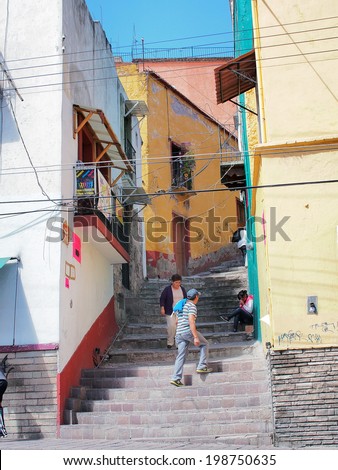 GUANAJUATO, MEXICO - OCTOBER 26, 2013: World Heritage Site (1988). Historic mine city has a lot of colorful 16th century buildings and narrow stone paved streets. About 170,000 population.