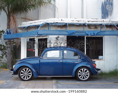 AGUASCALIENTES, MEXICO - OCTOBER 9, 2013: Old blue volkswagen beetle car in the city of Aguascalientes, Aguascalientes state in Mexico. Aguascalientes has about 1 million population.