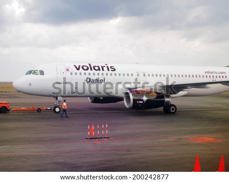 AGUASCALIENTES, MEXICO - NOVEMBER 16, 2013: Volaris air plane at Aguascalientes airport. Belongs to Concesionaria Vuela Compania de Aviacion, S.A. de C.V. The second largest mexican airline.