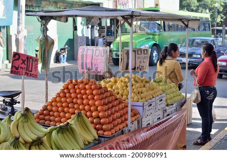 AGUASCALIENTES, MEXICO - NOVEMBER 10, 2013: Fruits vendor photographed in downtown Aguascalientes city, Aguascalientes State, North central Mexico.