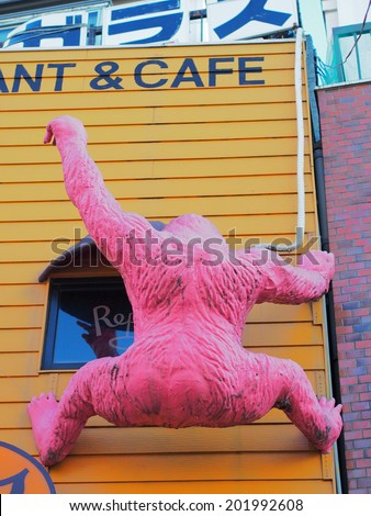 KOIWA, TOKYO - JANUARY 11, 2014: Pink King Kong miniature on the wall of restaurant in Koiwa, downtown Tokyo, Japan.
