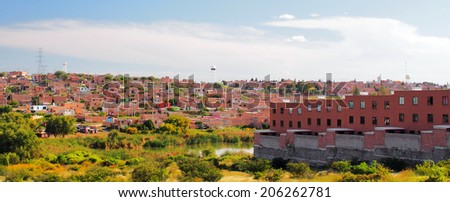 AGUASCALIENTES, MEXICO - OCTOBER 6, 2013:  Housing development for influx of people in Fraccionamiento Los Pericos area of Aguascalientes city, one of the most rapidly growing city in Mexico.