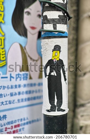 SHIBUYA, TOKYO - JULY 14, 2014: Artistic sticker graffiti or street art in Shibuya area, downtown Tokyo, Japan.