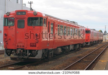 TOYAMA, JAPAN - NOVEMBER 24: Orange color passenger train of West Japan Railway Company (JR West) at Takaoka station in Takaoka city, Toyama prefecture.