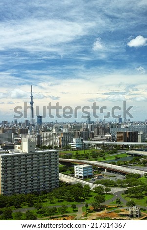 Megacity buildings, blue sky and white clouds and the Tokyo skytree