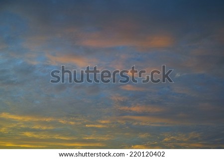 Orange clouds at sunset, background for homesickness, nostalgia or sentimentality