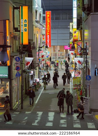 SHIBUYA, TOKYO - JANUARY 6, 2014: Back street at night in the commercial district of Shibuya, Tokyo.