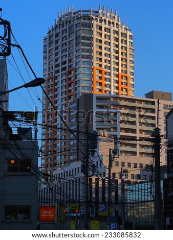 SHIBUYA, TOKYO - JANUARY 6, 2014: City scape of Shibuya commercial district with buildings densely stand in row.