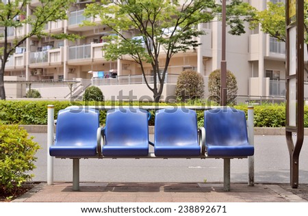 KOTO, TOKYO - JULY 21, 2013: Blue plastic benches of bus stop. This bus stop belongs to Bureau of Transportation Tokyo Metropolitan Government.