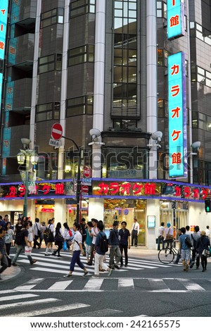 SHINJUKU, TOKYO - MAY 31, 2014: Karaoke bar building with neon billboards in Shinjuku, the biggest business, shopping, restaurants and night life district in Japan.