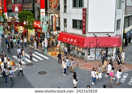 SHINJUKU, TOKYO - MAY 31, 2014: Street view of Shinjuku commercial district, one of the biggest and busiest town in Japan.
