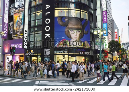 SHINJUKU, TOKYO - MAY 31, 2014: Optician\'s shop Megane Ichiba (Translation: Glass Market) with big poster of a popular female singer and model Kyary Pamyu Pamyu.