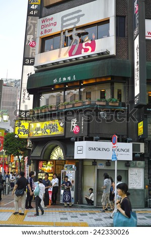SHINJUKU, TOKYO - MAY 31, 2014: Commercial building with many billboards in Shinjuku, the biggest business, shopping, restaurants and night life district in Japan.