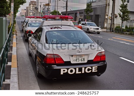 KOTO, TOKYO - JUNE 4, 2014:	Metropolitan Police Department or MPD patrol vehicle in Koto Ward, downtown Tokyo. The MPD is a police force of the capital of Japan and has around 1,300 patrol cars.