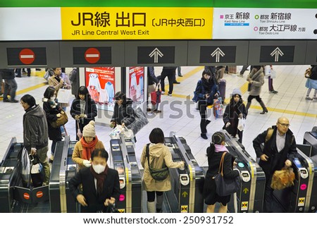 SHINJUKU, TOKYO - DECEMBER 20, 2014: Entrance gate with automatic ticketing machines in the Shinjuku station of East Japan Railway Company (JR)