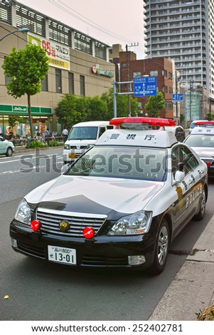 KOTO, TOKYO - JUNE 4, 2014:	Metropolitan Police Department or MPD patrol vehicle in Koto Ward, downtown Tokyo. The MPD is a police force of the capital of Japan and has around 1,300 patrol cars.