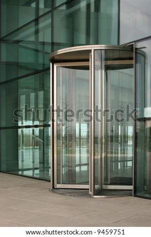 Revolving glass door on a modern corporate building