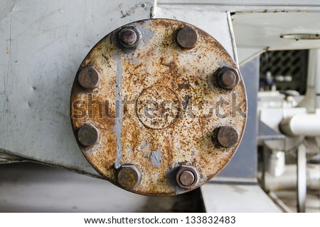 a rusty cast iron pipe flange