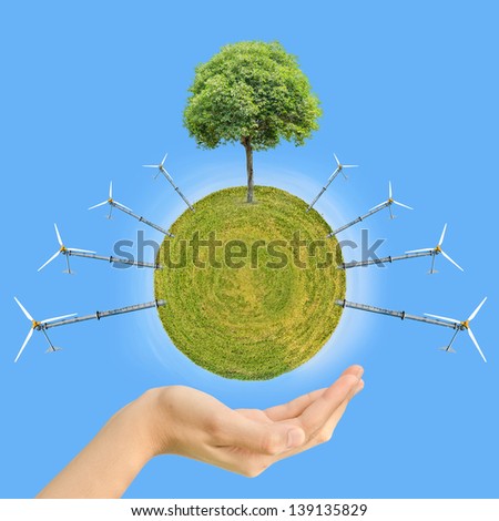 hand hold green globe with wind energy