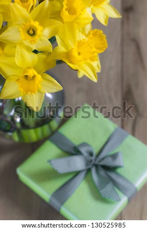 Lent lily daffodil in a glass vase with Easter gift