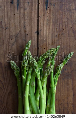 fresh green asparagus on a wooden table