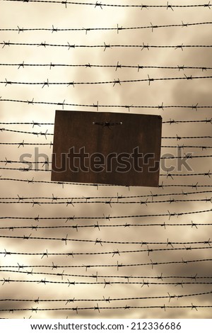 Barbed wire and prohibition sign as a symbol for freedom or prison