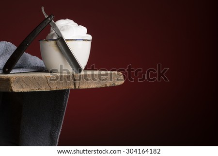 vintage Shaving Tool on Wood and dark red Background