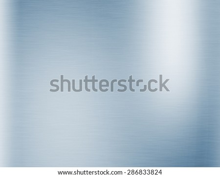 Metal blue background or texture of brushed steel plate with reflections