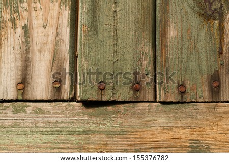 old worn wooden planks with rusty nails