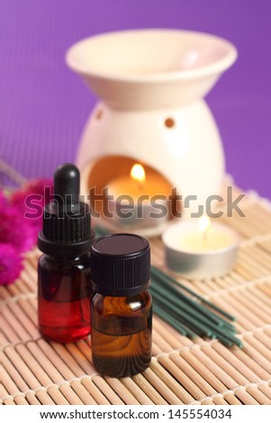 2 bottles of essential oil, aromatherapy burner and candles. Let\'s go spa!
