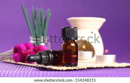 2 bottles of essential oil, aromatherapy burner and candles. Let\'s go spa!
