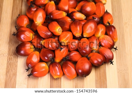 A group of oil palm fruits on the cutting board