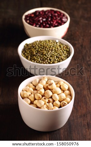 Lotus seeds, Red beans and green beans in white bowl on table