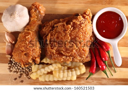 Hot and crispy fried chicken, french fries, chili, garlic and black pepper