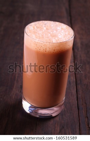 Teh tarik is comprised of black tea, sugar, and condensed milk mixed to frothy perfection.